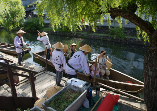 Tourists enjoying a cruise on a small boat on the river in Bikan historical quarter
, Okayama Prefecture, Kurashiki, Japan