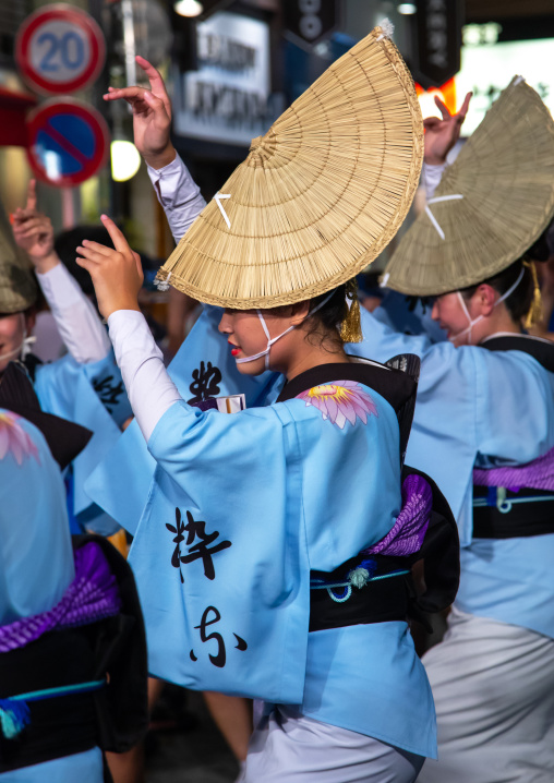Japanese women with straw hats during the Koenji Awaodori dance summer street festival, Kanto region, Tokyo, Japan