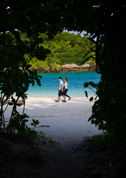 Japanese couple wandering on Kabira bay, Yaeyama Islands, Ishigaki-jima, Japan