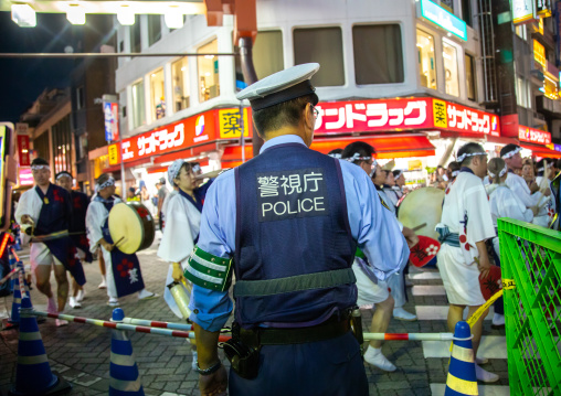 Police during the Koenji Awaodori dance summer street festival, Kanto region, Tokyo, Japan