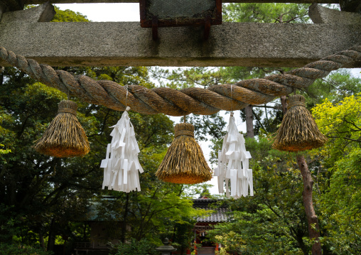 Torii gate braided rope and papers decorations in Kenroku-en garden, Ishikawa Prefecture, Kanazawa, Japan