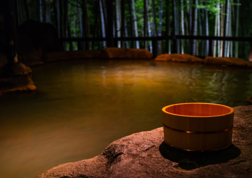 Bamboo bucket next to a forest hot spring in Takefue ryokan, Kumamoto Prefecture, Minamioguni-machi, Japan