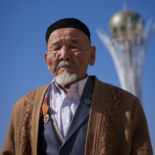 Old Veteran In Front Of Baiterek Tower, Astana, Kazakhstan