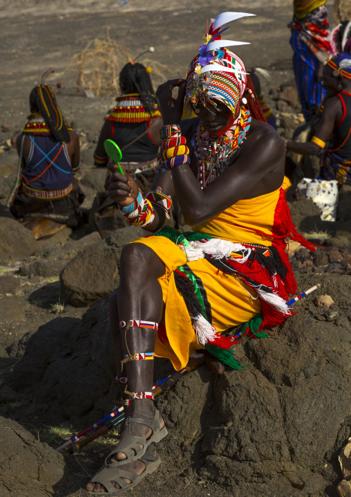 Portrait of rendille warriors applying make up, Turkana lake, Loiyangalani, Kenya