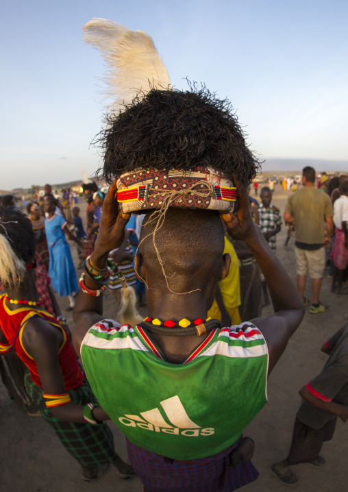 Turkana tribesman with headwear made of ostrich blackfeathers, Turkana lake, Loiyangalani, Kenya