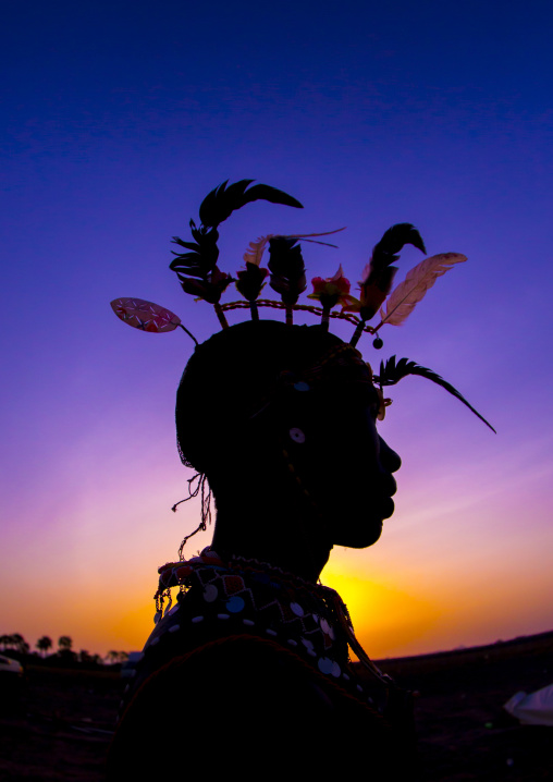 Silhouette of rendille warrior wearing traditional headwear, Turkana lake, Loiyangalani, Kenya