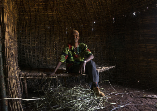 Borana tribe man inside a hut, Chalbi desert, Marsabit, Kenya