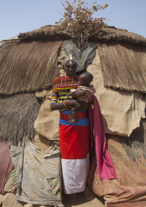 Rendille tribeswoman holding her baby, Marsabit district, Ngurunit, Kenya