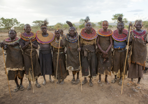 Group of pokot women wearing large necklaces made from the stems of sedge grass, Baringo county, Baringo, Kenya