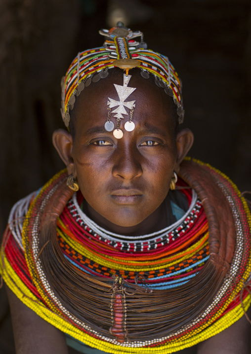 Rendille tribeswoman wearing traditional headdress and mpooro engorio necklace, Marsabit district, Ngurunit, Kenya