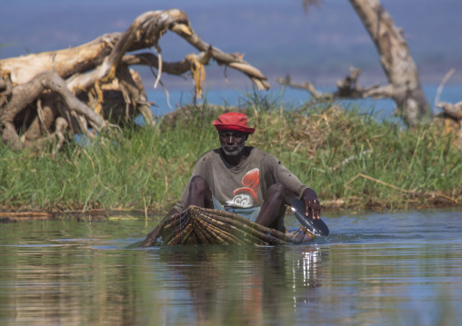 Fisherman in traditional boat rowing
, Baringo county, Baringo, Kenya