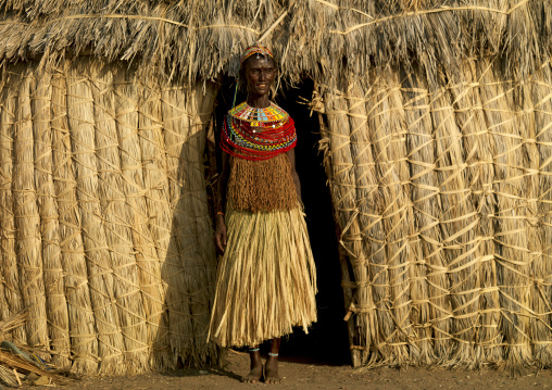 Portrait of an El Molo tribe woman standing in the entrance of her house, Rift Valley Province, Turkana lake, Kenya