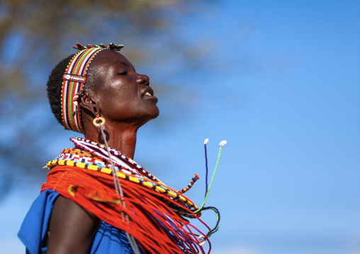Samburu tribe woman with beaded necklaces dancing, Samburu County, Maralal, Kenya