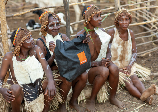 Tharaka women in traditional clothing with an Orange telecom bag, Laikipia County, Mount Kenya, Kenya