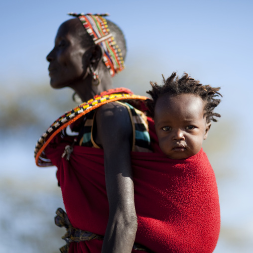Portrait of a Samburu tribe woman with her child in the back, Samburu County, Maralal, Kenya