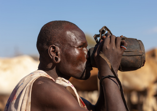 Samburu tribe man drinking cow blood, Samburu County, Maralal, Kenya