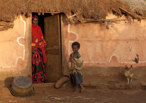 Portrait of a Borana tribe woman and her daughter in front of her house, Marsabit County, Marsabit, Kenya
