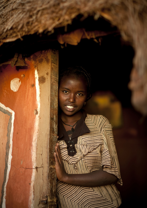 Portrait of a Borana tribe girl in front of her house, Marsabit County, Marsabit, Kenya