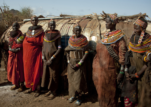 Rendille tribe women with leather skirts in front of a hut, Marsabit County, Marsabit, Kenya