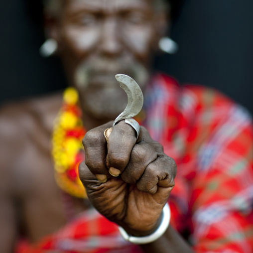 Portrait of a Turkana tribe man with a blade on his hand, Rift Valley Province, Turkana lake, Kenya