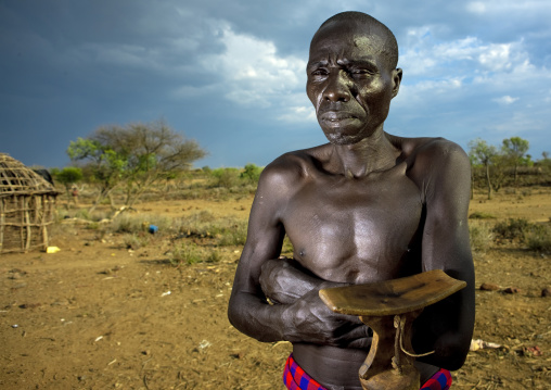 Portrait of a Pokot tribe man with a wooden pillow, Baringo County, Baringo, Kenya