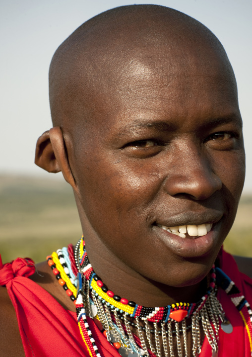 Smiling Maasai man with large earlobe, Rift Valley Province, Maasai Mara, Kenya