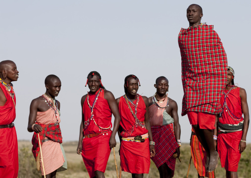 Maasai tribe men jumping during a ceremony, Rift Valley Province, Maasai Mara, Kenya