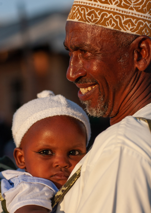 Muslim father with his baby, Lamu County, Lamu, Kenya