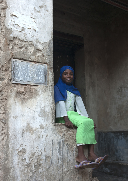 Swahili girl sitting in the street, Lamu County, Lamu, Kenya