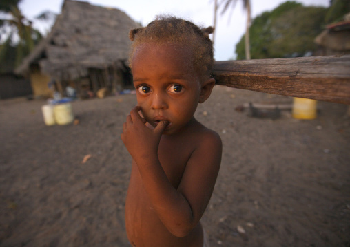 Boy standing in front of his house, Lamu County, Lamu, Kenya