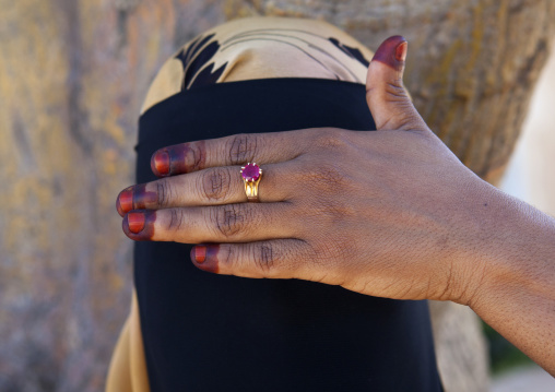 Young muslim woman wearing niqab hiding her eyes with hand, Lamu County, Lamu, Kenya