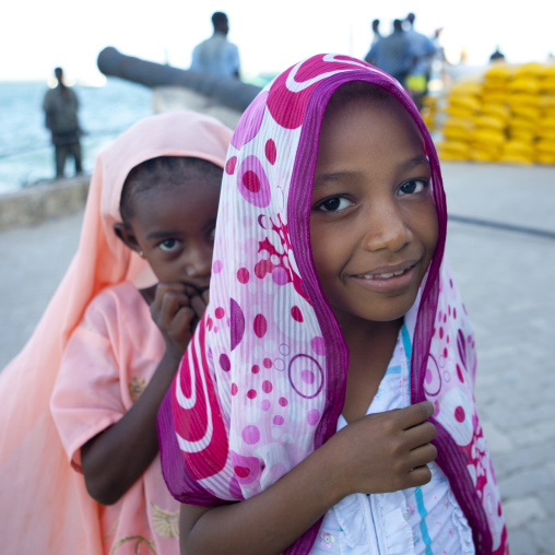 Two young muslim girls with colorful veils, Lamu County, Lamu, Kenya