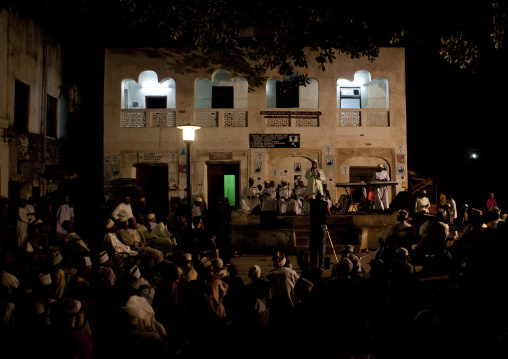 Crowd listening to muslim poetry reciting during Maulid festival, Lamu County, Lamu, Kenya