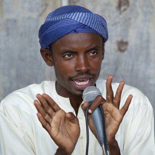 Muslim man talking in a microphone, Lamu County, Lamu, Kenya