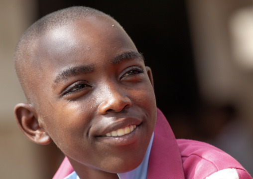 Smiling boy with shaved head, Lamu County, Lamu, Kenya