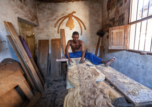 Wood carver in his workshop, Lamu County, Lamu, Kenya