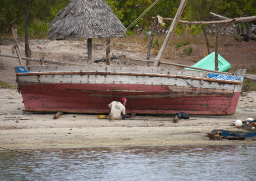 A shipbuilder on the beach, Lamu County, Lamu, Kenya