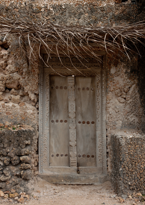 Carved wooden front door of a traditional house, Lamu County, Siyu, Kenya