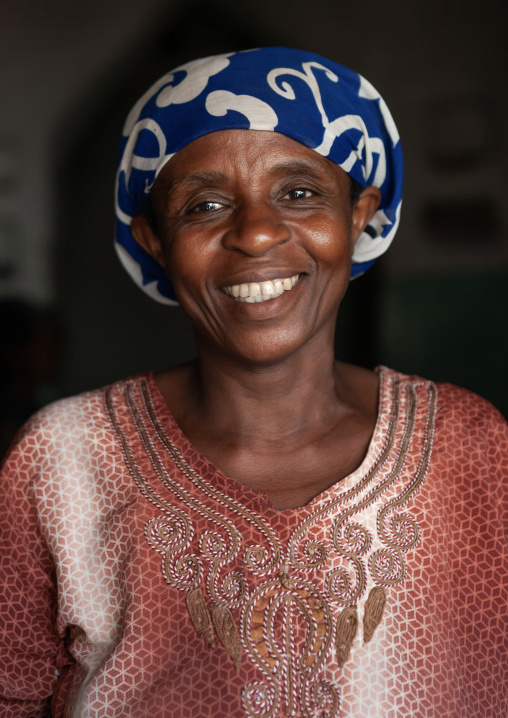 Portrait of a smiling woman with colorful clothing, Lamu County, Siyu, Kenya