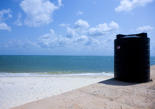 Black watertank near the beach, Lamu County, Pate Island, Kenya