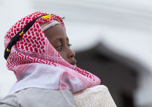 Sunni muslim boy dressed  with a keffieh for the maulidi festivities, Lamu county, Lamu town, Kenya