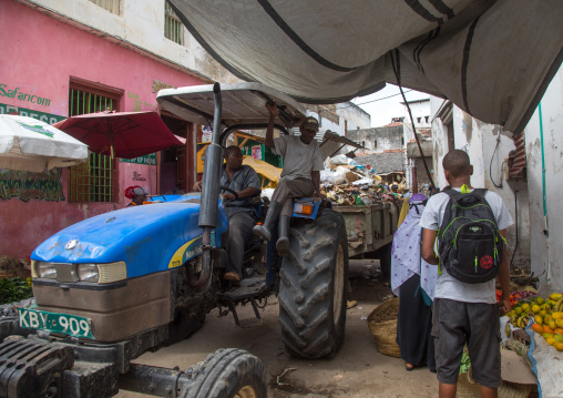Tractor collecting garbages in the street, Lamu county, Lamu town, Kenya