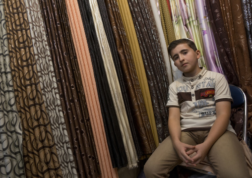 Young Boy Selling Clothes In Qaysari Bazaar, Erbil, Kurdistan, Iraq