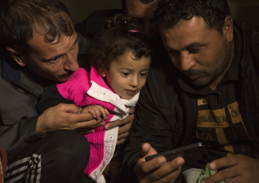 Yezedi Refugees From Sinjar Making A Conference On A Mobile Phone With Relatives, Zohar, Kurdistan, Iraq