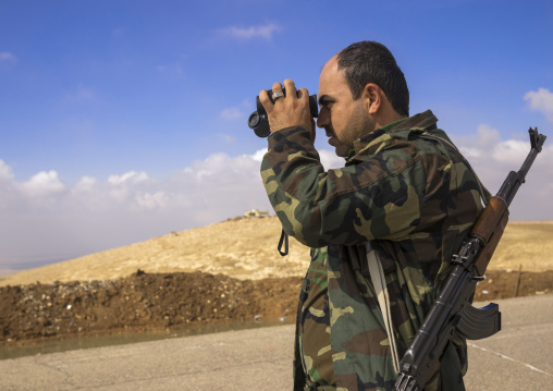 Kurdish Peshmerga Looking With Binoculars On The Frontline, Duhok, Kurdistan, Iraq