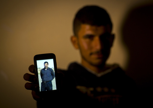 Yezedi Refugee From Sinjar Showing A Relative Killed By Daesh On His Mobile Phone, Zohar, Kurdistan, Iraq