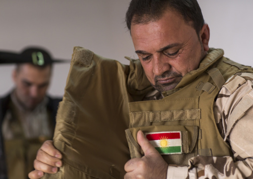 Kurdish Peshmerga On The Frontline Putting A Bulletproof Jacket, Duhok, Kurdistan, Iraq