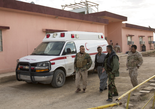 Kurdish Peshmergas On The Frontline In Front Of An Ambulance, Kirkuk, Kurdistan, Iraq