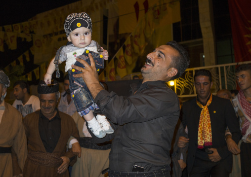 Man Holding His Baby During A Kdp Meeting, Suleymanyah, Kurdistan, Iraq