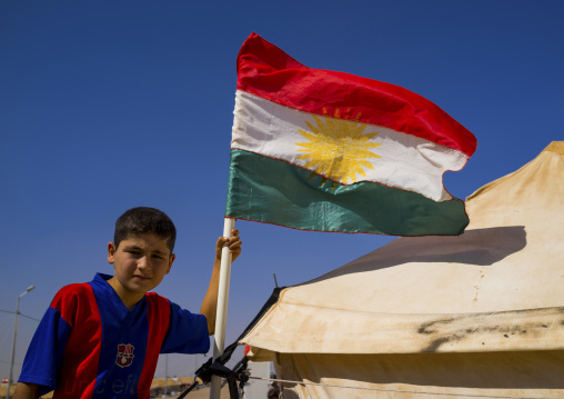 Syrian Refugee Child With A Barcelona Shirt In Front Of His Tent, Erbil, Kurdistan, Iraq
